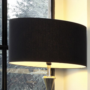 Black Oval A black oval lampshade on a silver floor lamp