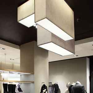 Bespoke grey rectangular ceiling light shades in a clothing store