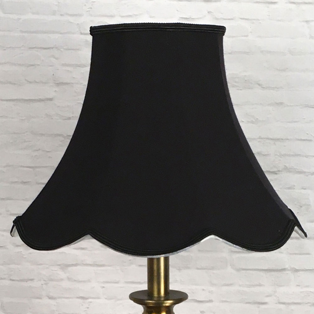 Black scalloped lampshade switched off
