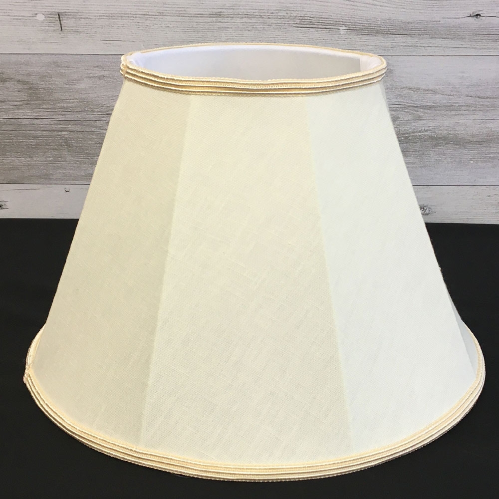 Close up image of our Retro straight sided Empire lampshade in a Cream brushed cotton with a matching Oyster Soutache trim. Showing the soft white balloon lining.