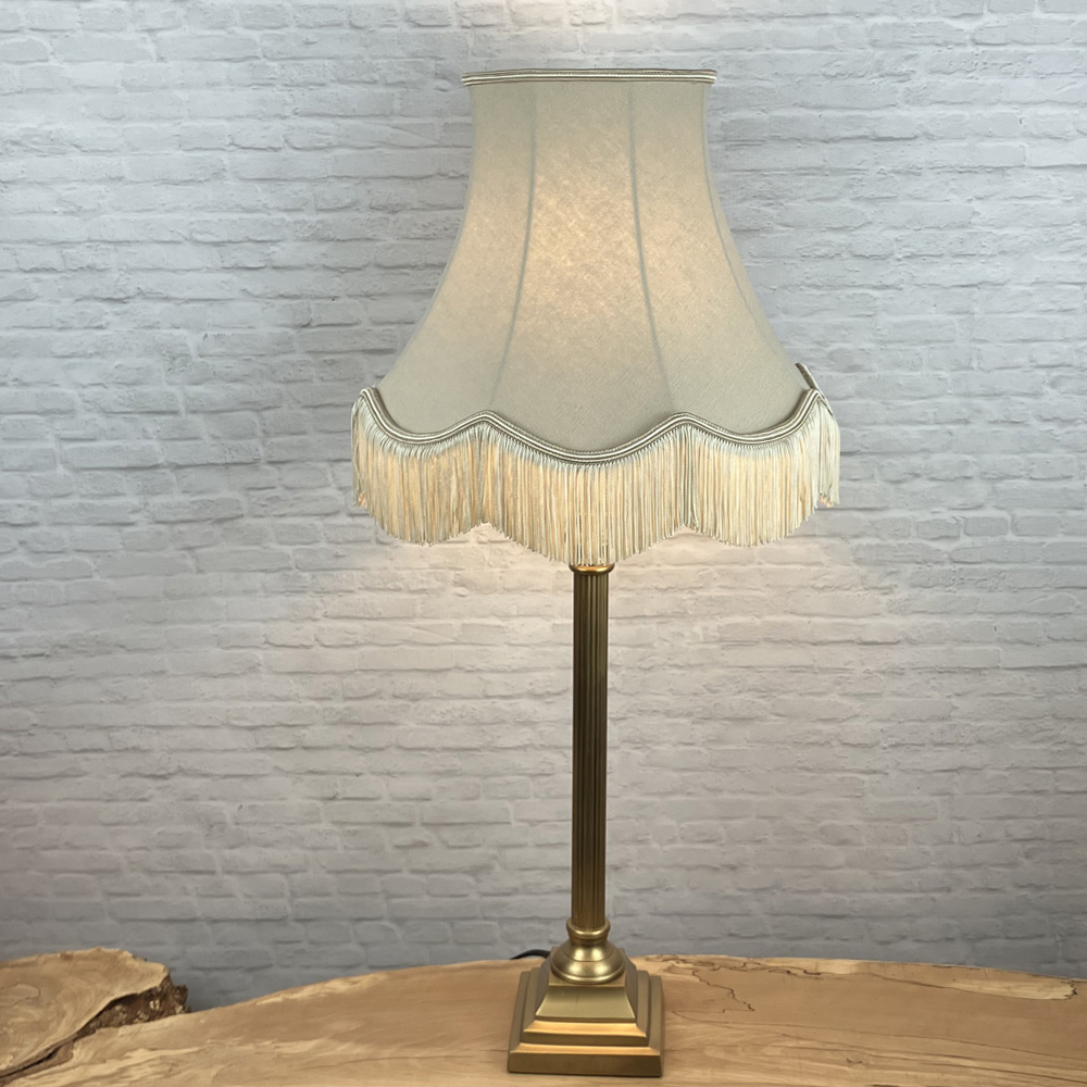 fawn scalloped lampshade with fringe on table lamp