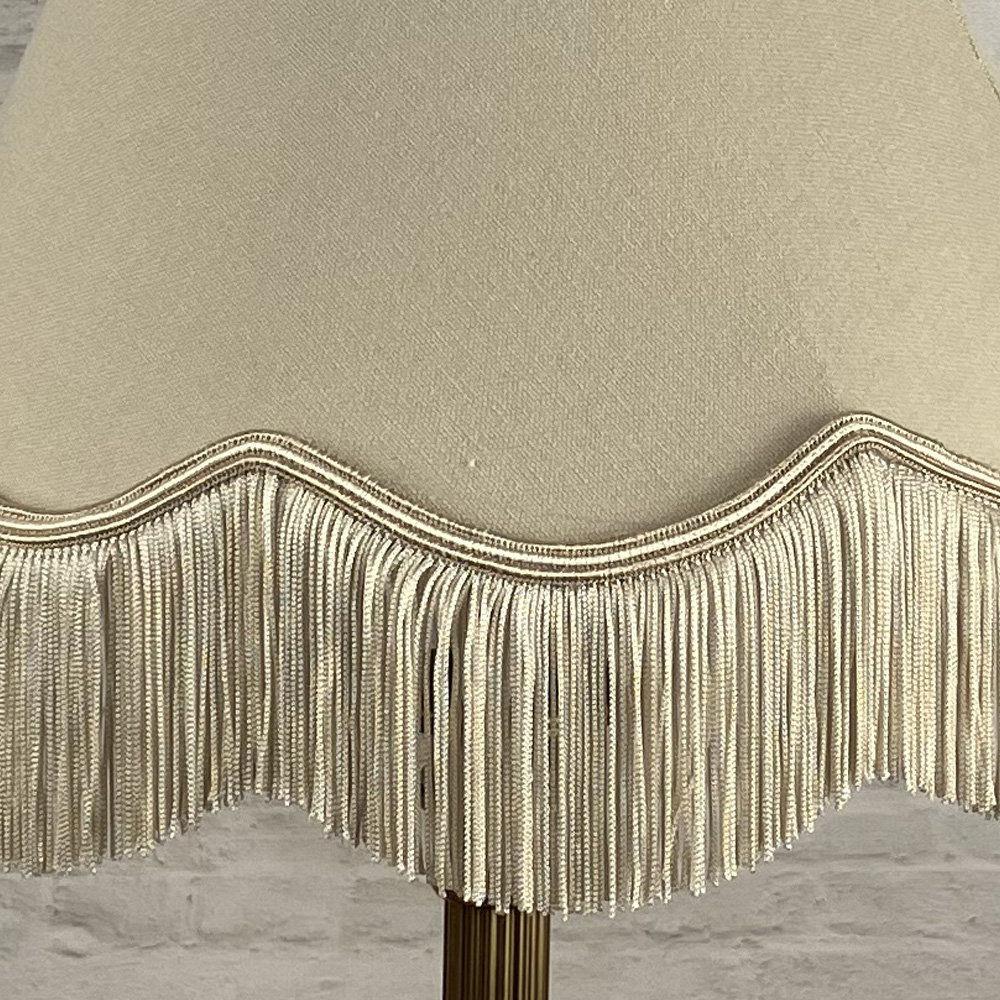 Close up of fawn scaloped lampshade fringe
