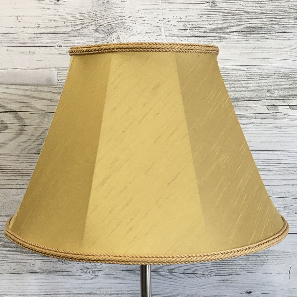 Close up image of our Retro straight sided Empire lampshade in a Old Gold Faux Silk with a matching Old Gold Rope Braid. Switched off