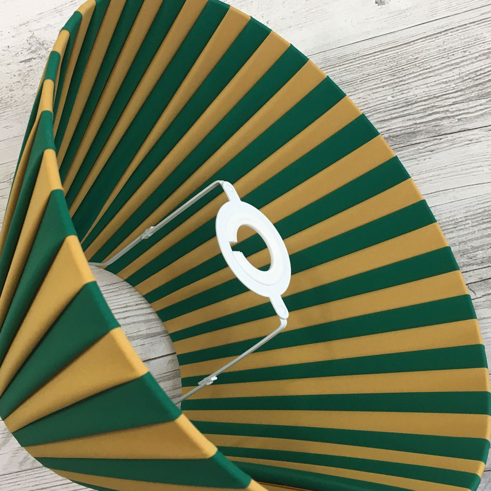 Pleated Lightshade shown on its side in Green and Gold stripe