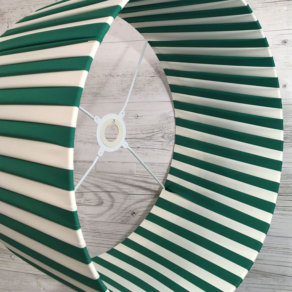 Pleated Lightshade shown on its side in green and cream stripe