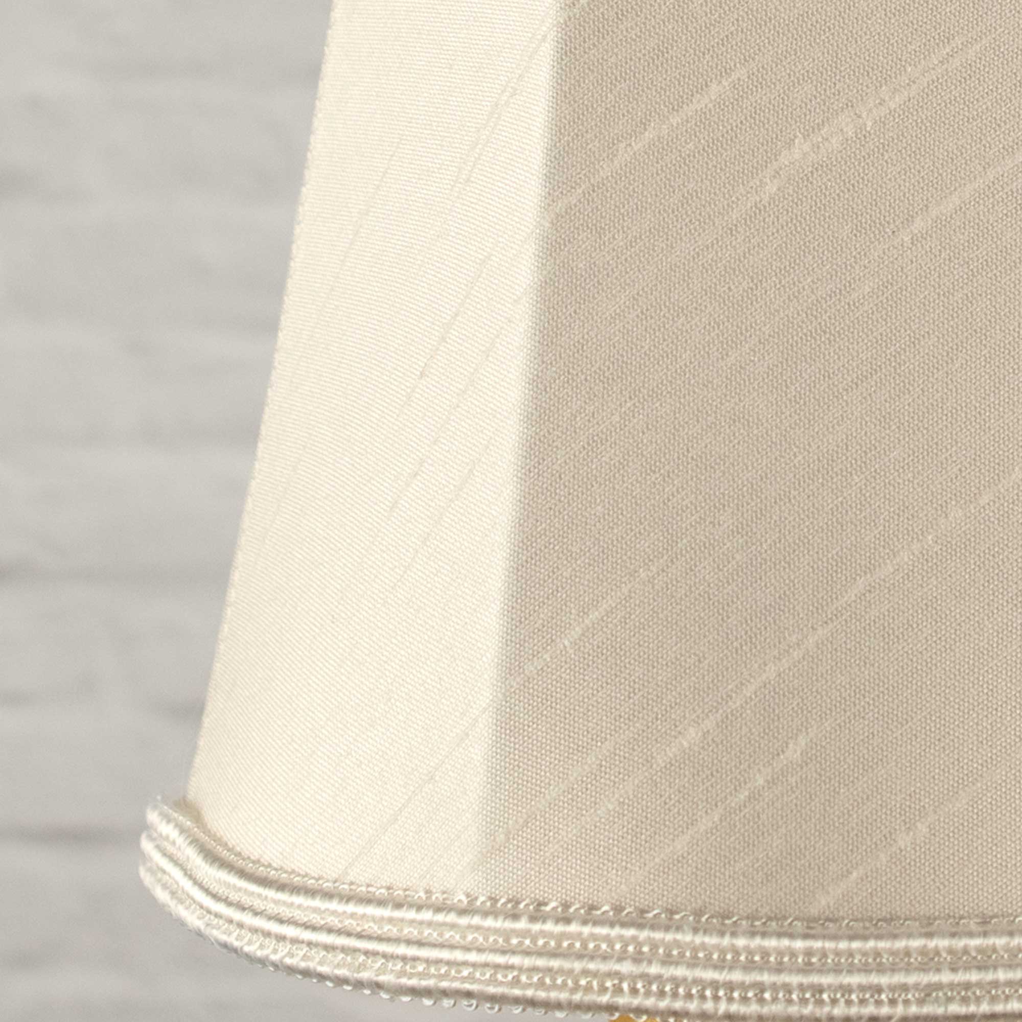 Close-up of natural faux silk fabric showing dupion slub texture on empire chandelier shade
