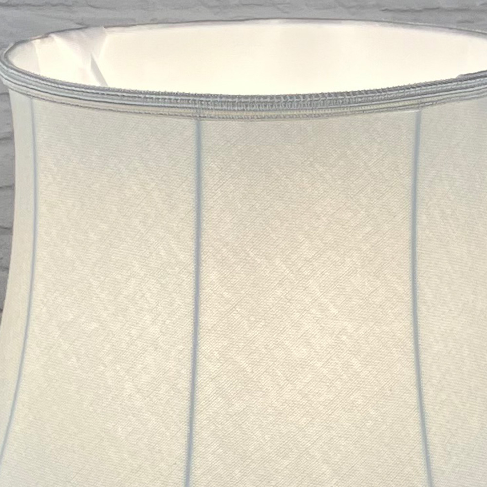 Close up image of a Traditional Natural Brushed Cotton Lampshade with a matching Soutache Trim, showing the inside soft white lining