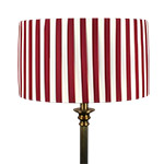 A cream and red striped drum shade