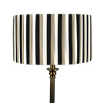 A striped pleated drum shade in black cream and khaki colours