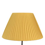 A gold pleated empire shaped lampshade