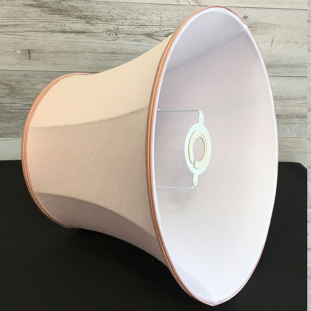 Inside view of the Sugar Almond Pink Linen Bowed Drum with a Rose Pink Soutache. Showing the soft white internal lining