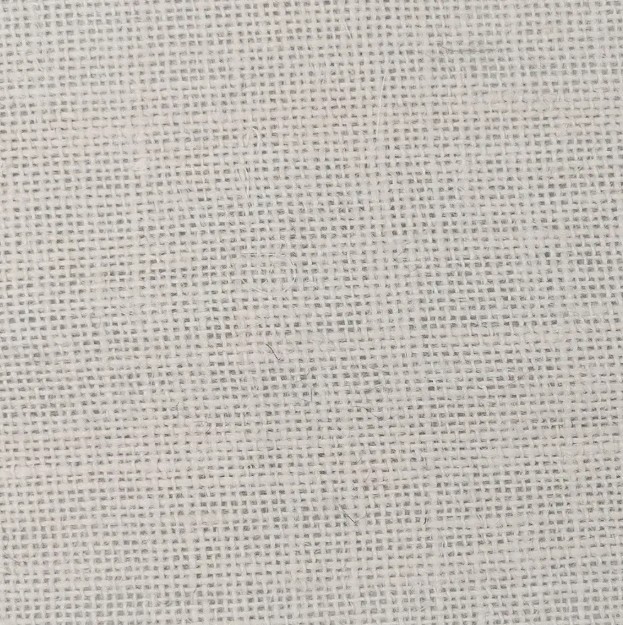 Off-white hessian fabric lampshade close up texture