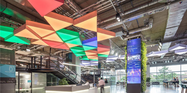Clusters of triangular lampshades supplied to a trade prodject