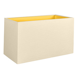 A rectangular lampshade in cream with contrasting gold lining