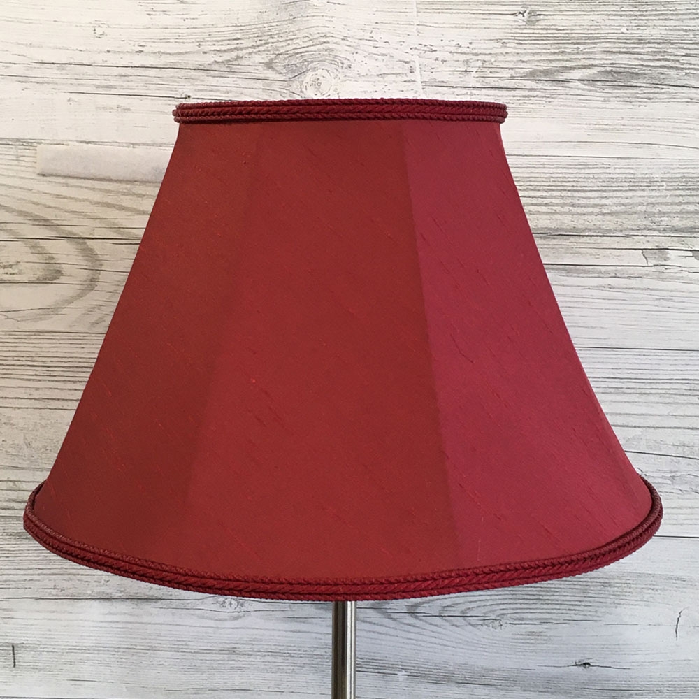 Close up image of our Retro straight sided Empire lampshade in a Ruby Faux Silk with a matching Ruby Rope Braid. Switched off
