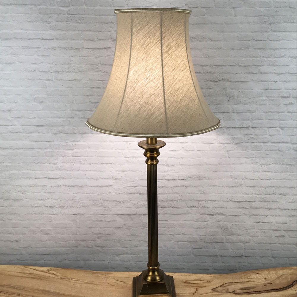 Table Lamp image of our Traditional Bowed Empire Lampshade in Husk Linen with a Two Tone Fawn and Oyster Soutache Trim. Shown Lit Up