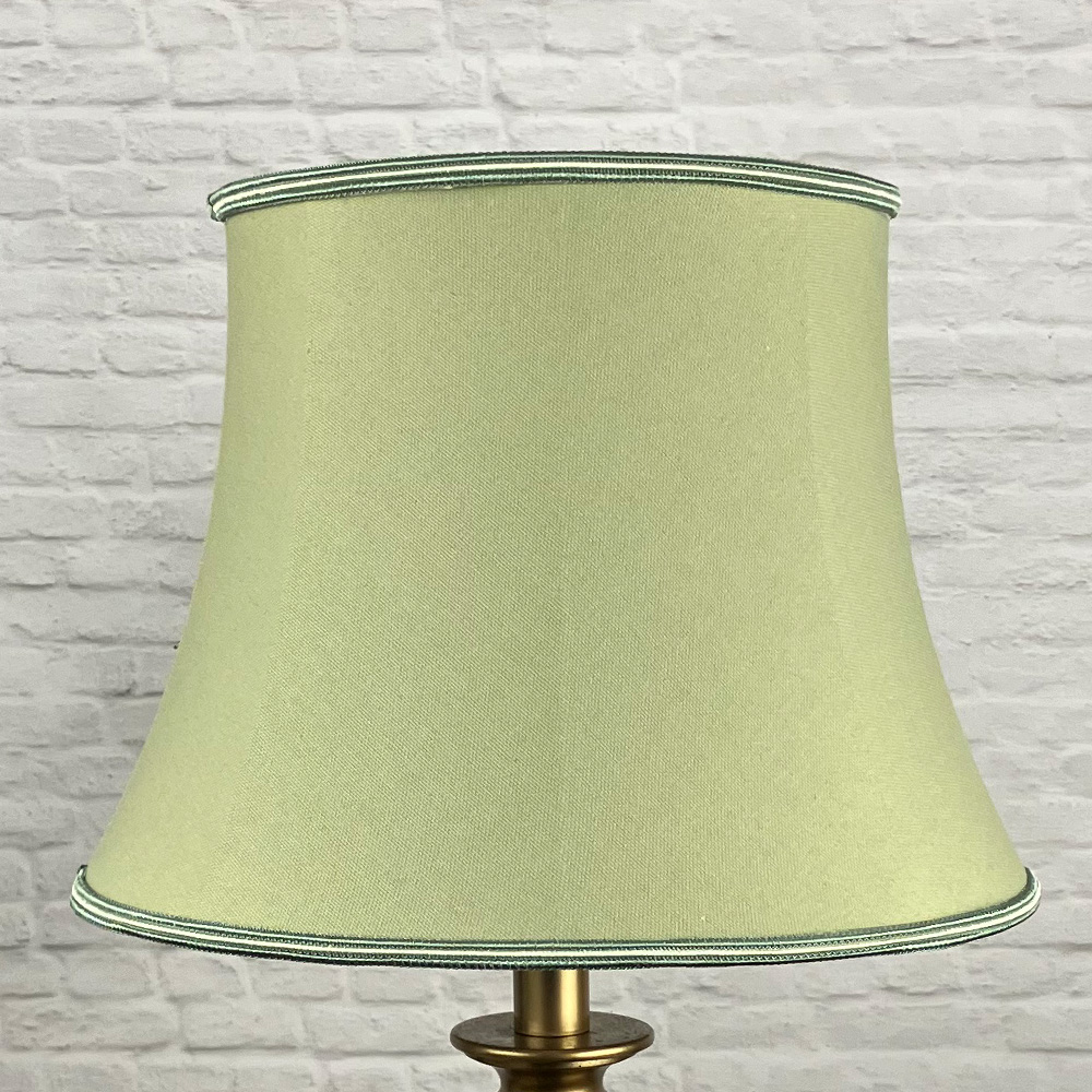 Traditional Green Bowed Drum Lampshade with two tone trim top and bottom, shown switched off
