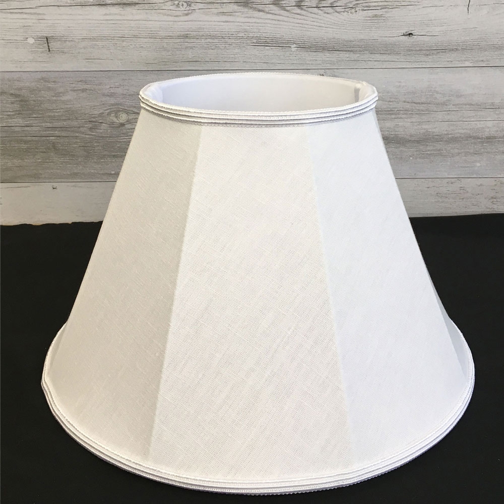 Close up image of our Retro straight sided Empire lampshade in a White brushed cotton with a matching White Soutache trim. Showing the soft white balloon lining.