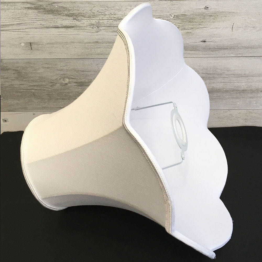 white scalloped traditional lampshade showing its lining