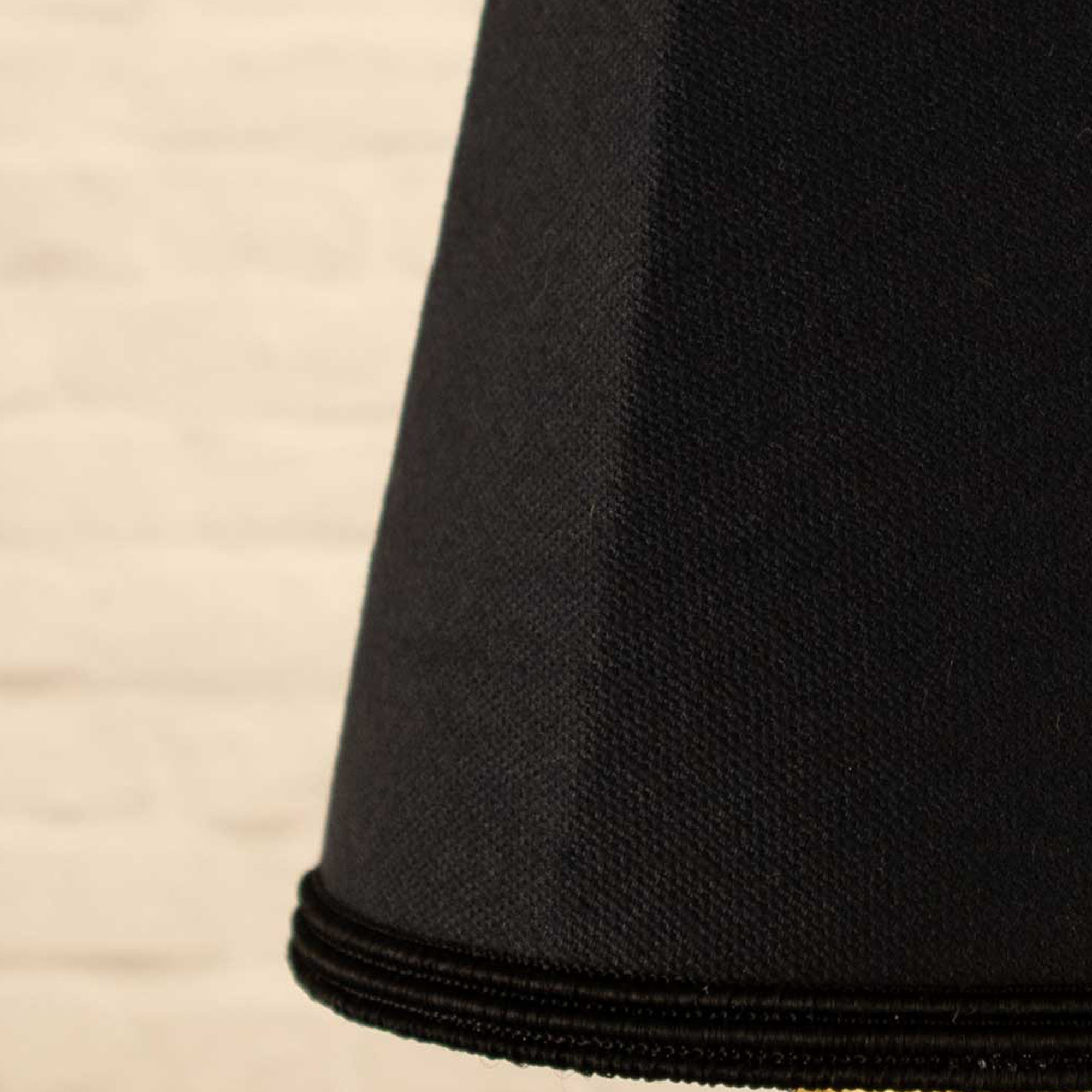 Close-up of black brushed cotton fabric and black soutache trim on empire candle shade