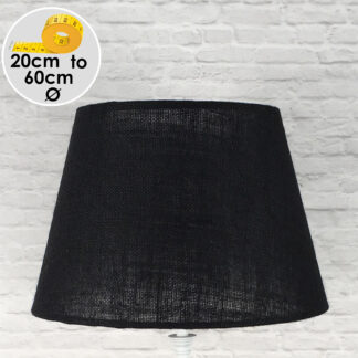Black hessian tapered drum lampshade handmade in Devon, shown against a neutral background