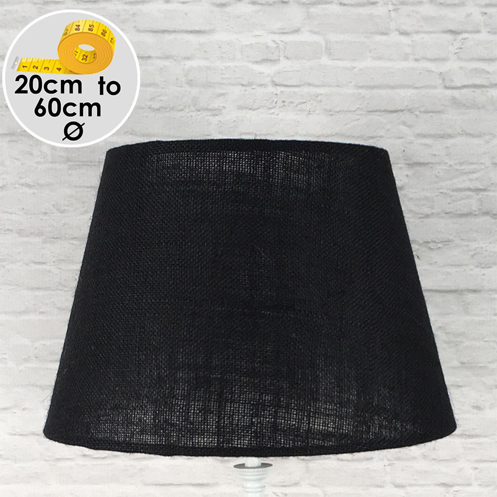 Black hessian tapered drum lampshade handmade in Devon, shown against a neutral background