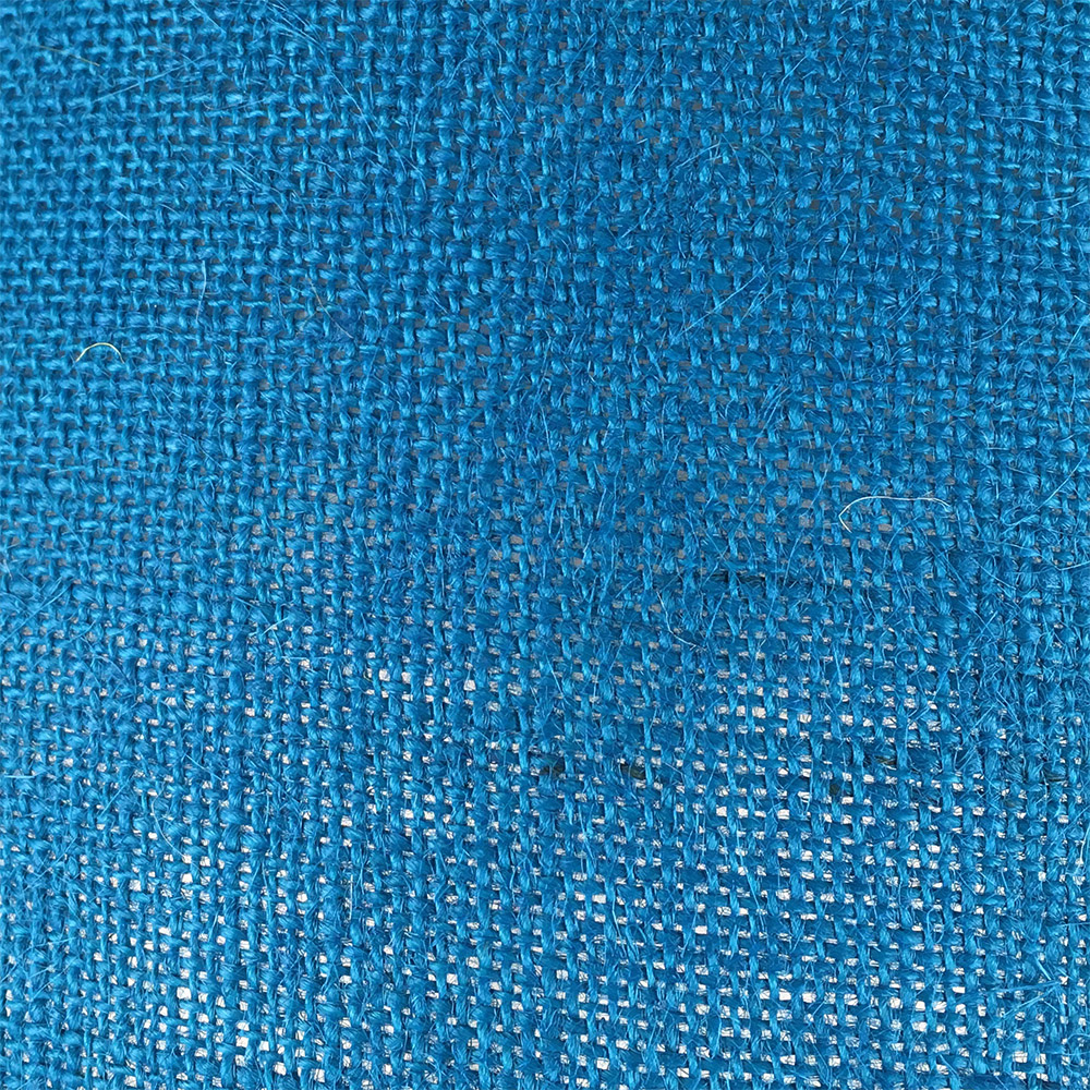 Blue hessian fabric lampshade close up texture