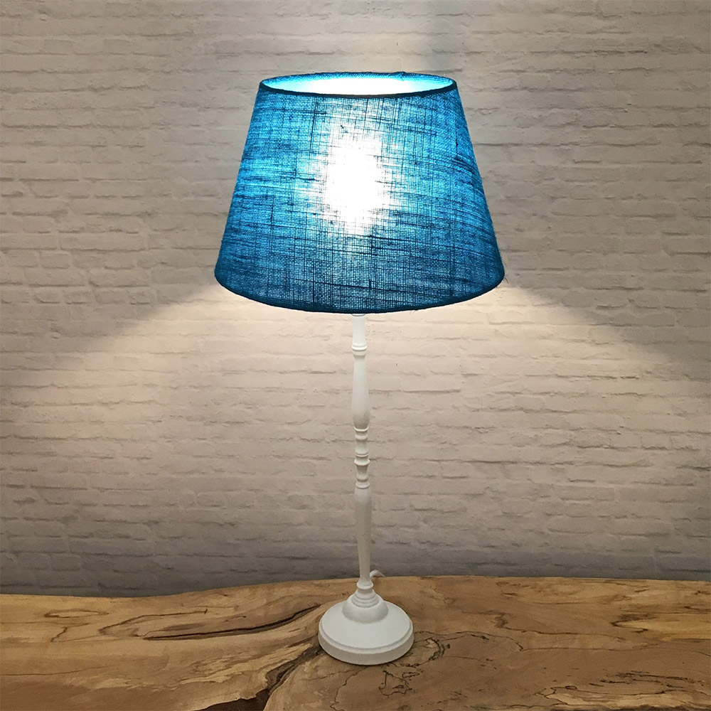 Blue hessian lampshade glowing when lit