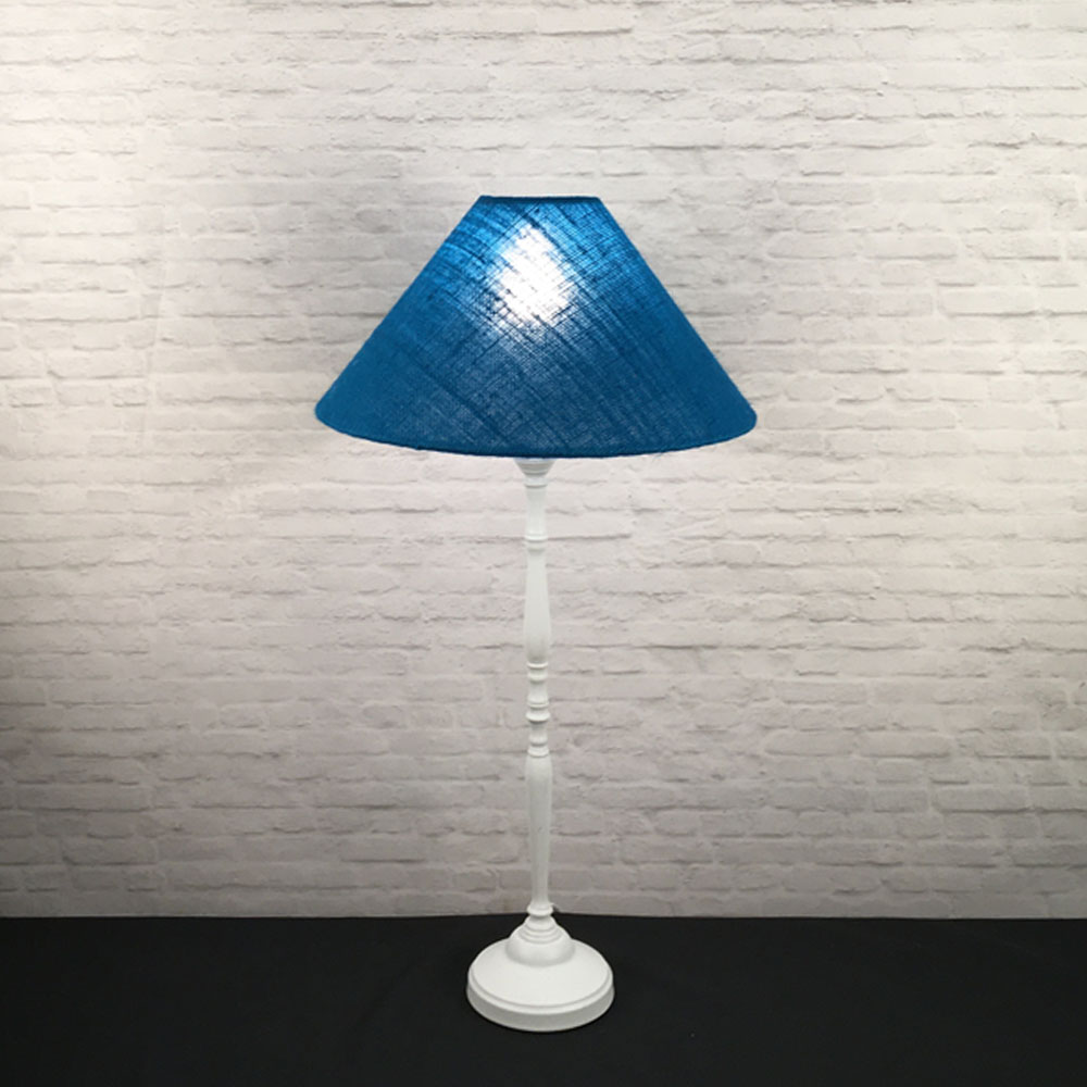 Blue burlap coolie table lamp illuminated