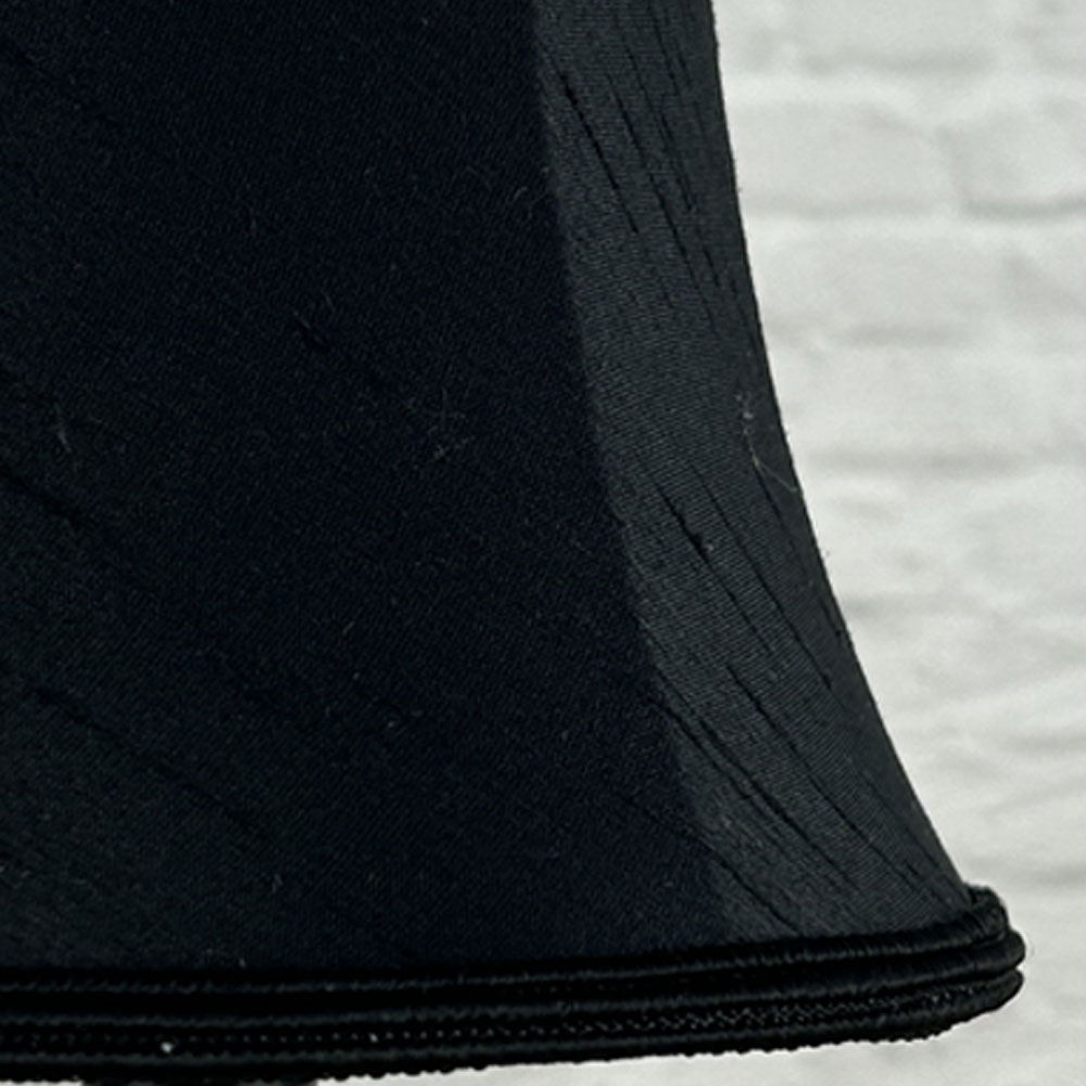 Close-up of black faux silk bowed chandelier shade with matching soutache trim