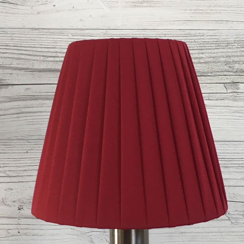 Burgundy ribbon empire candle lampshade on wall light close up