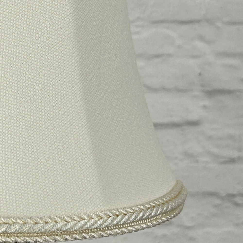 Close-up of cream brushed cotton bowed chandelier shade with rope trim