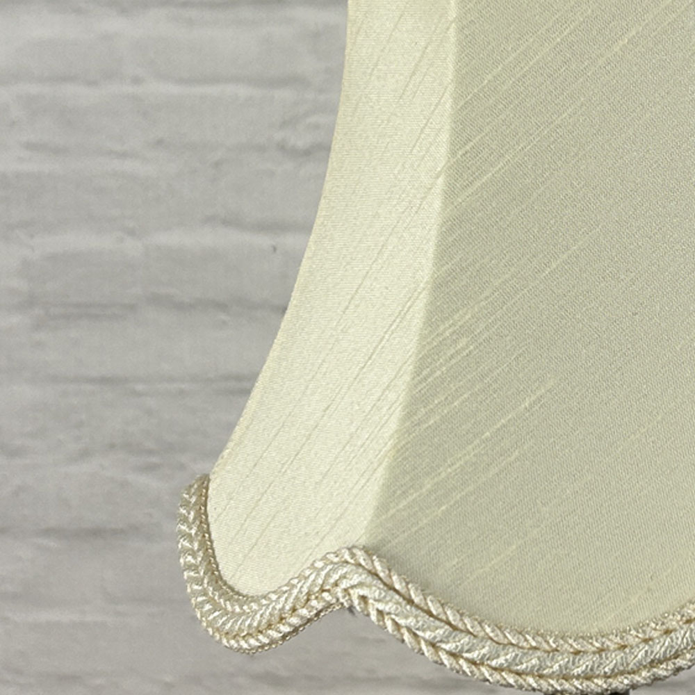 Close-up of cream faux silk scalloped chandelier shade with rope trim