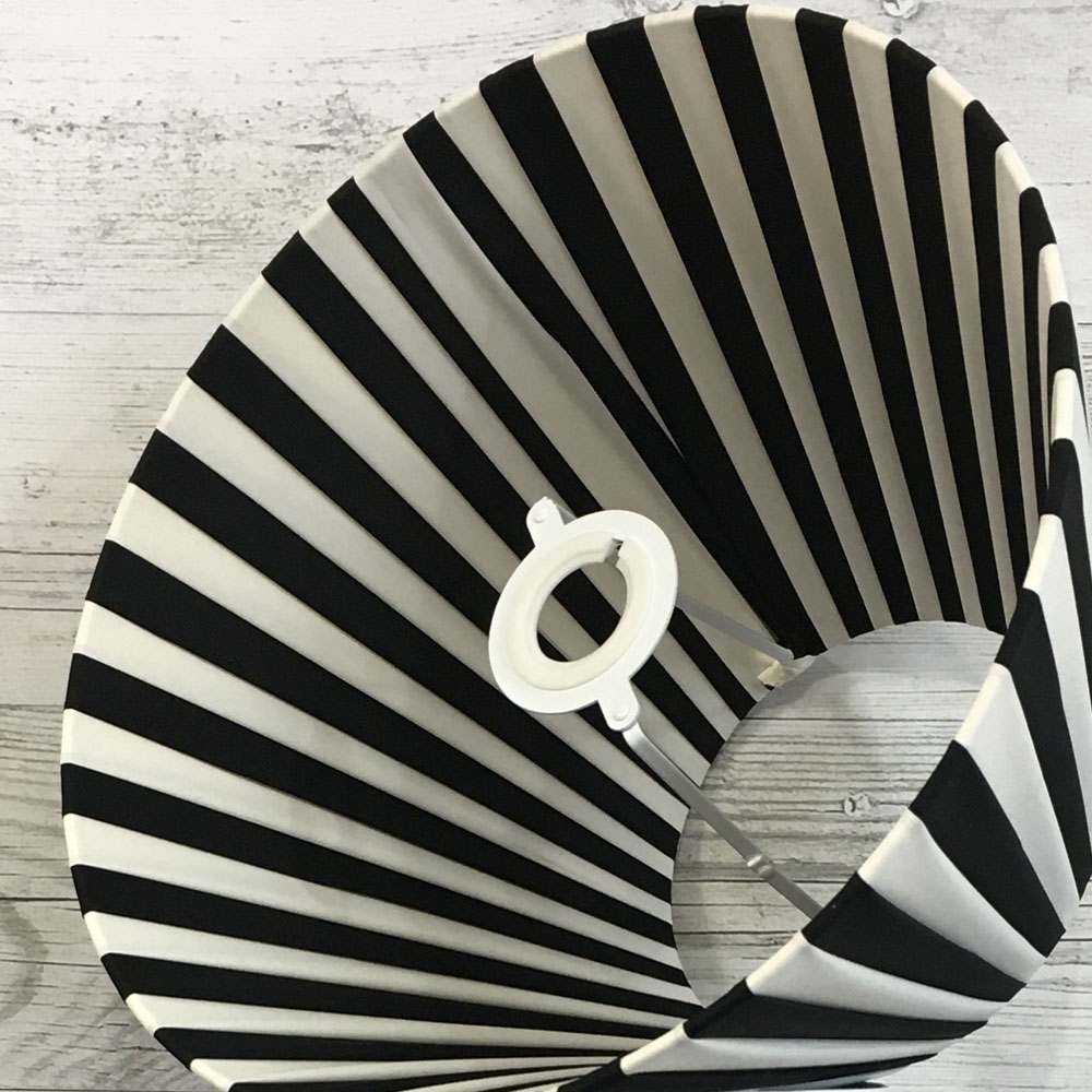 Cream and Black Pleated Lightshade shown on its side