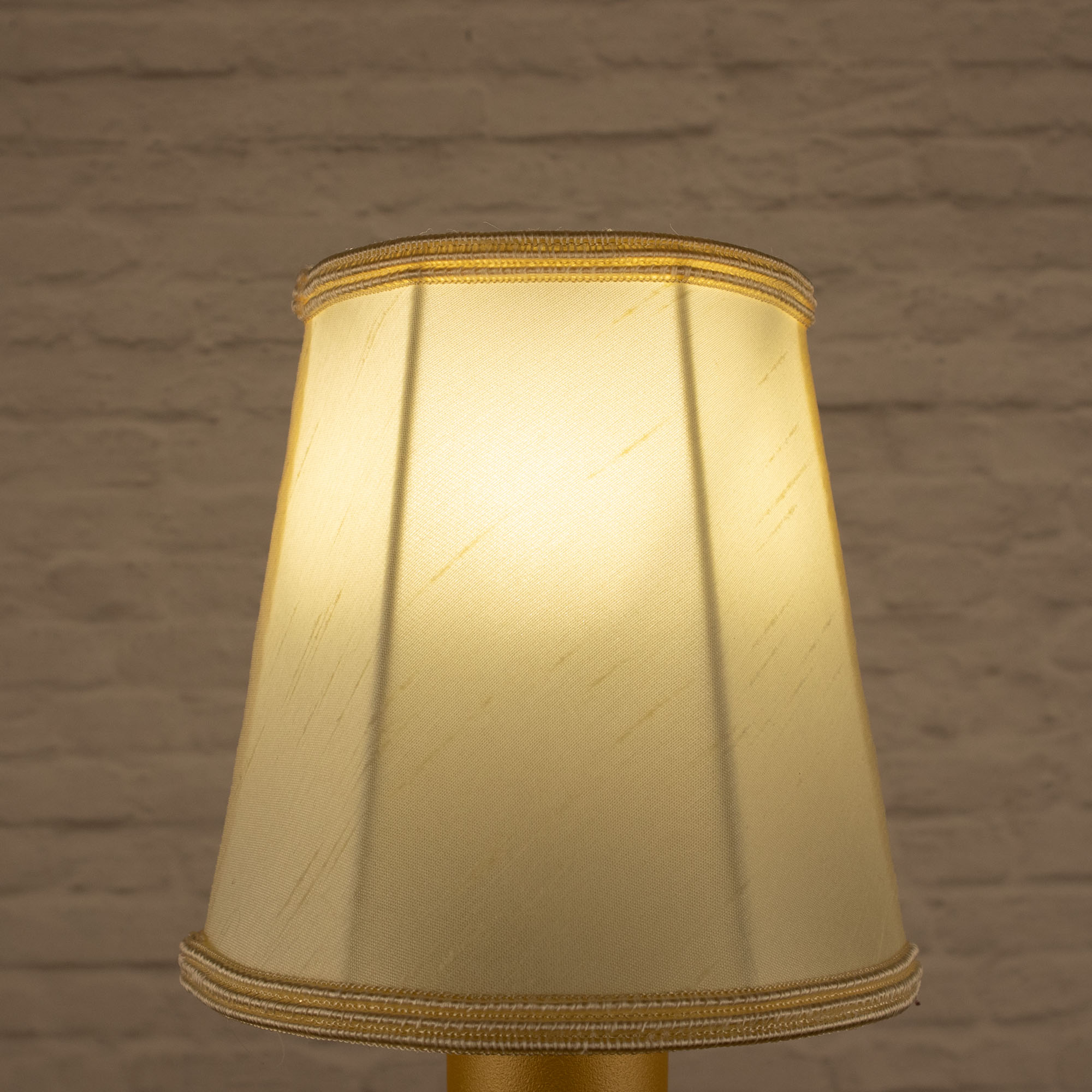 Lit cream empire faux silk chandelier shade with matching soutache trim