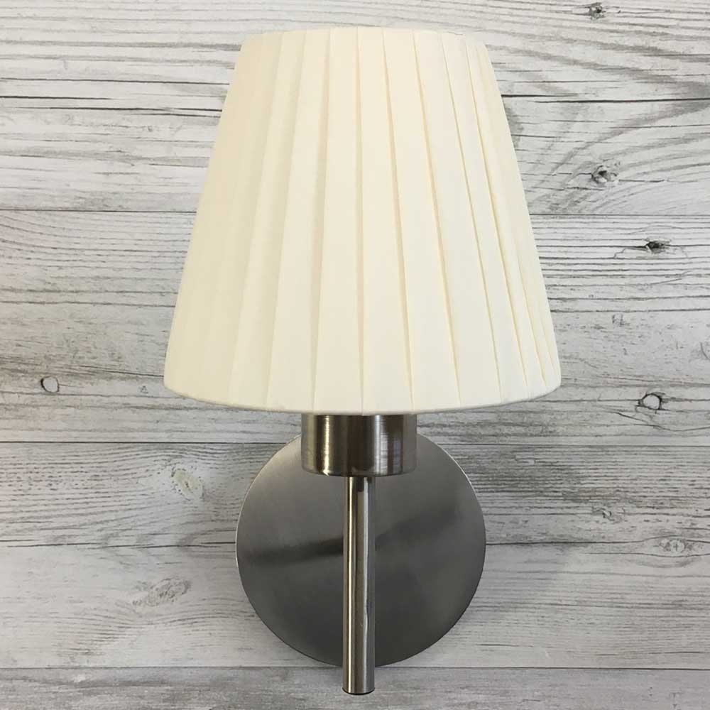 Cream ribbon empire candle lampshade on wall light