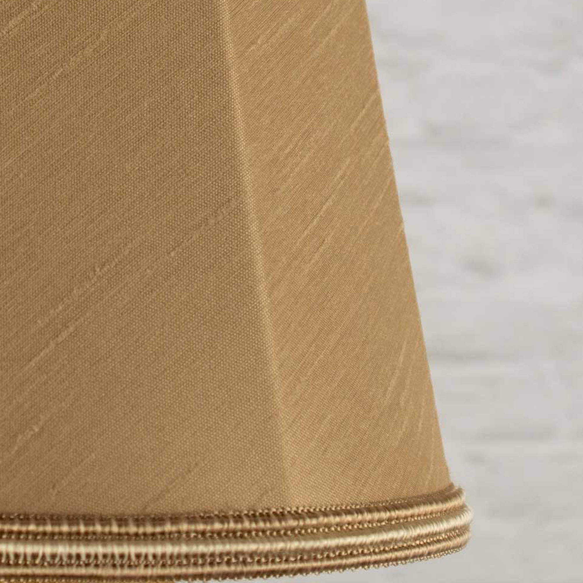 Close-up of fawn faux silk fabric showing dupion slub texture on empire chandelier shade