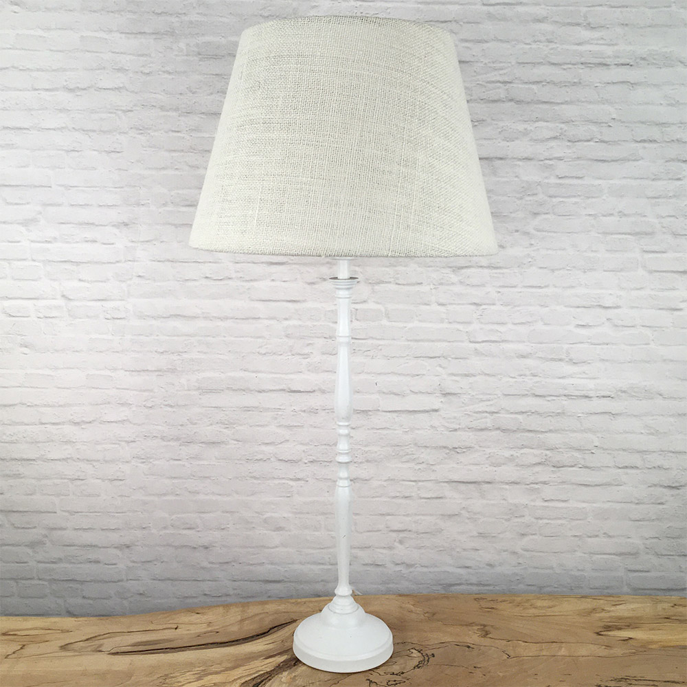 Off white hessian tapered drum lightshade unlit on table lamp