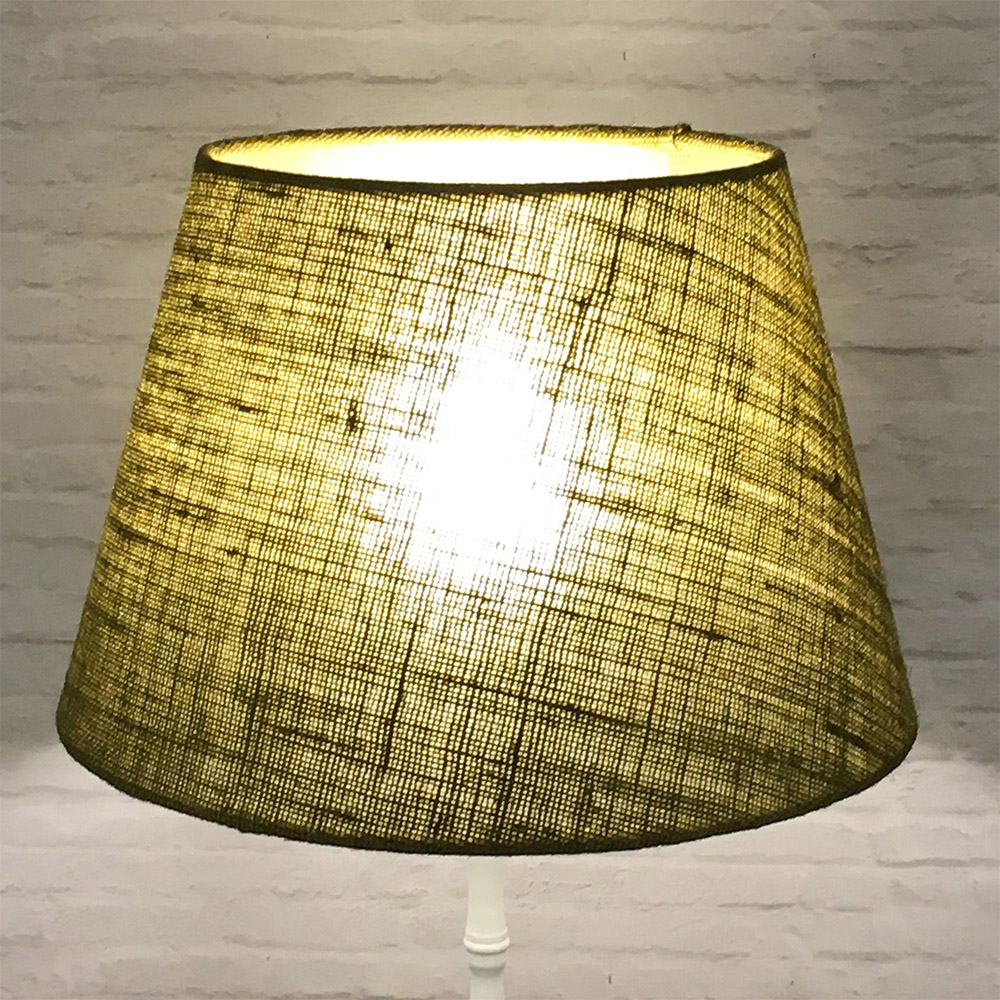 Olive green hessian drum lampshade on floor lamp