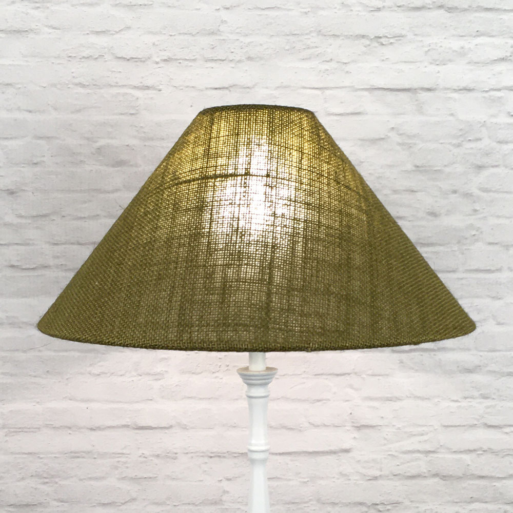 Olive Green hessian coolie on a standing lampshade lit