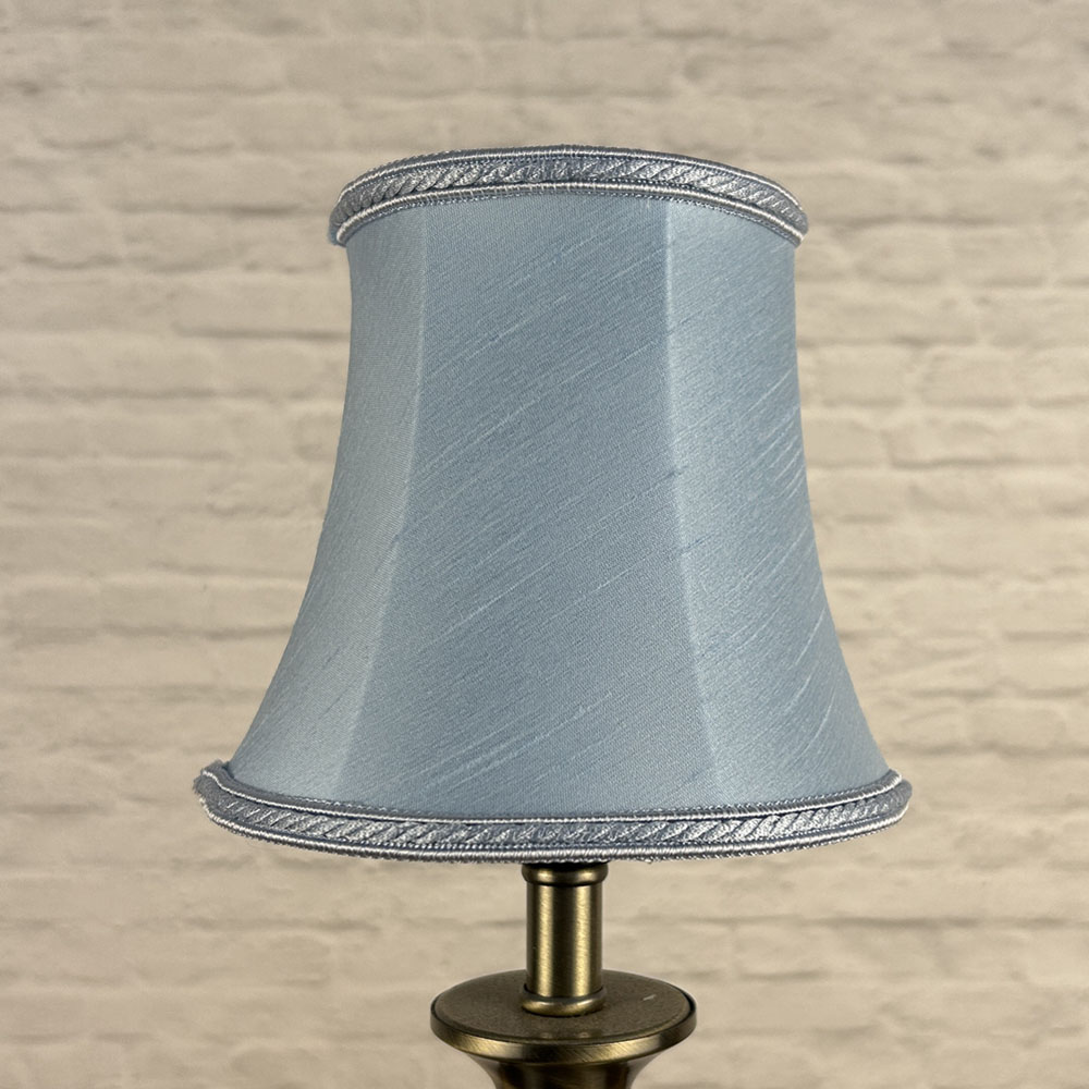 Pale blue faux silk bowed chandelier shade unlit