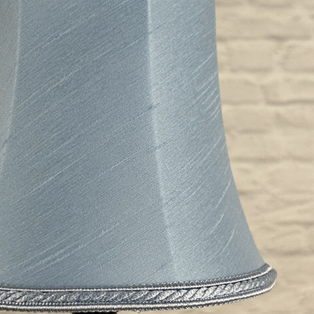 Close-up of pale blue faux silk bowed chandelier shade