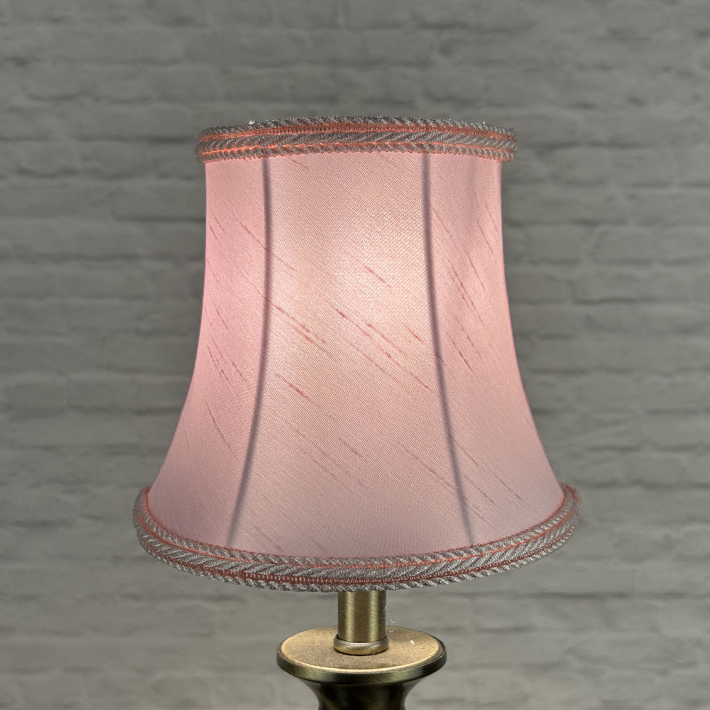 Pink bowed chandelier shade in faux silk lit showing soft colour