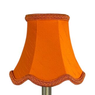 Scalloped faux silk lampshade in pumpkin with matching plait trim