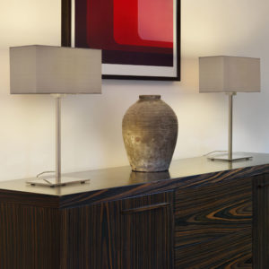 Two rectangular taupe coloured lampshades on silver table lamps