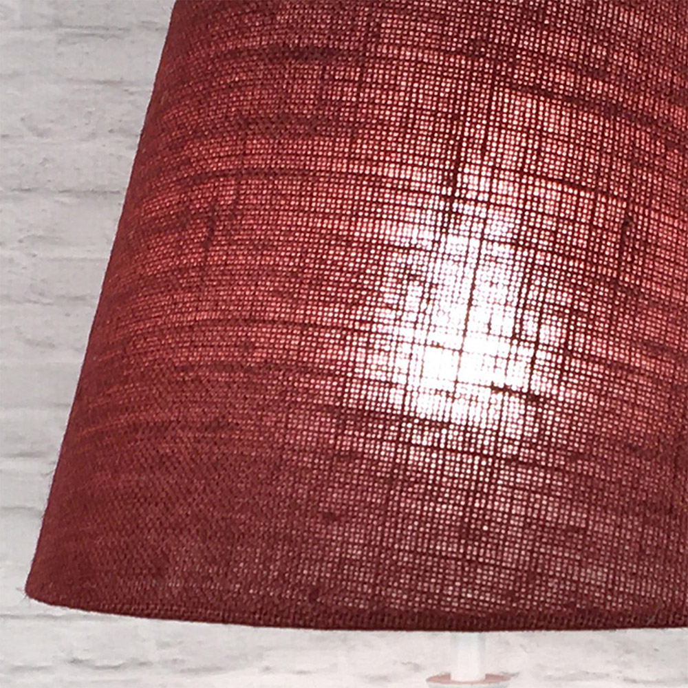 Close-up of red hessian lampshade showing woven burlap texture