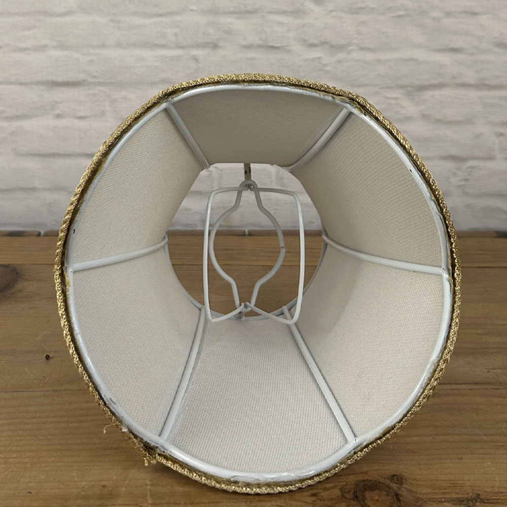Interior view of chandelier shade showing clip-on bulb fitting and internal frame