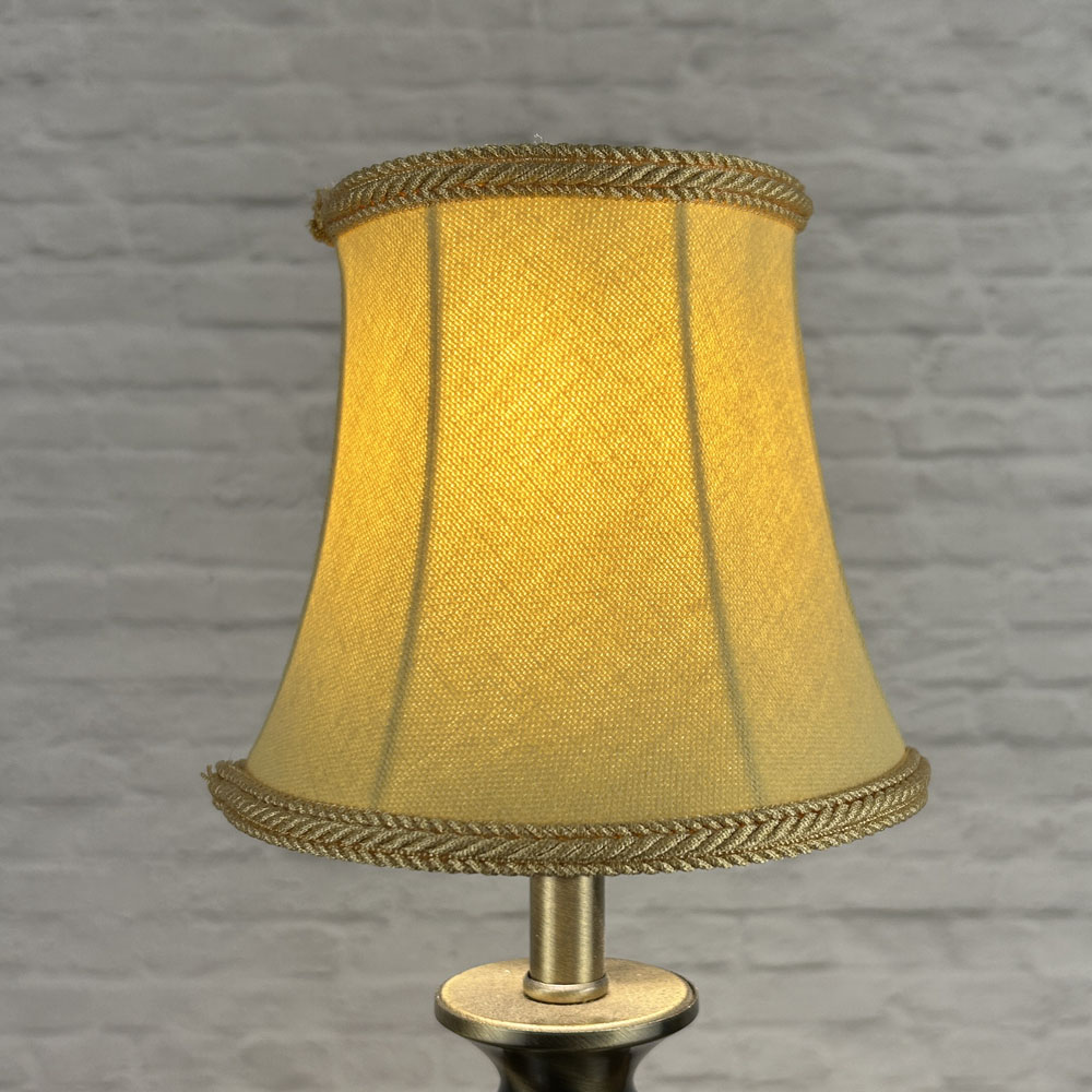 Soft gold bowed chandelier shade in brushed cotton lit showing warm tone and rope trim