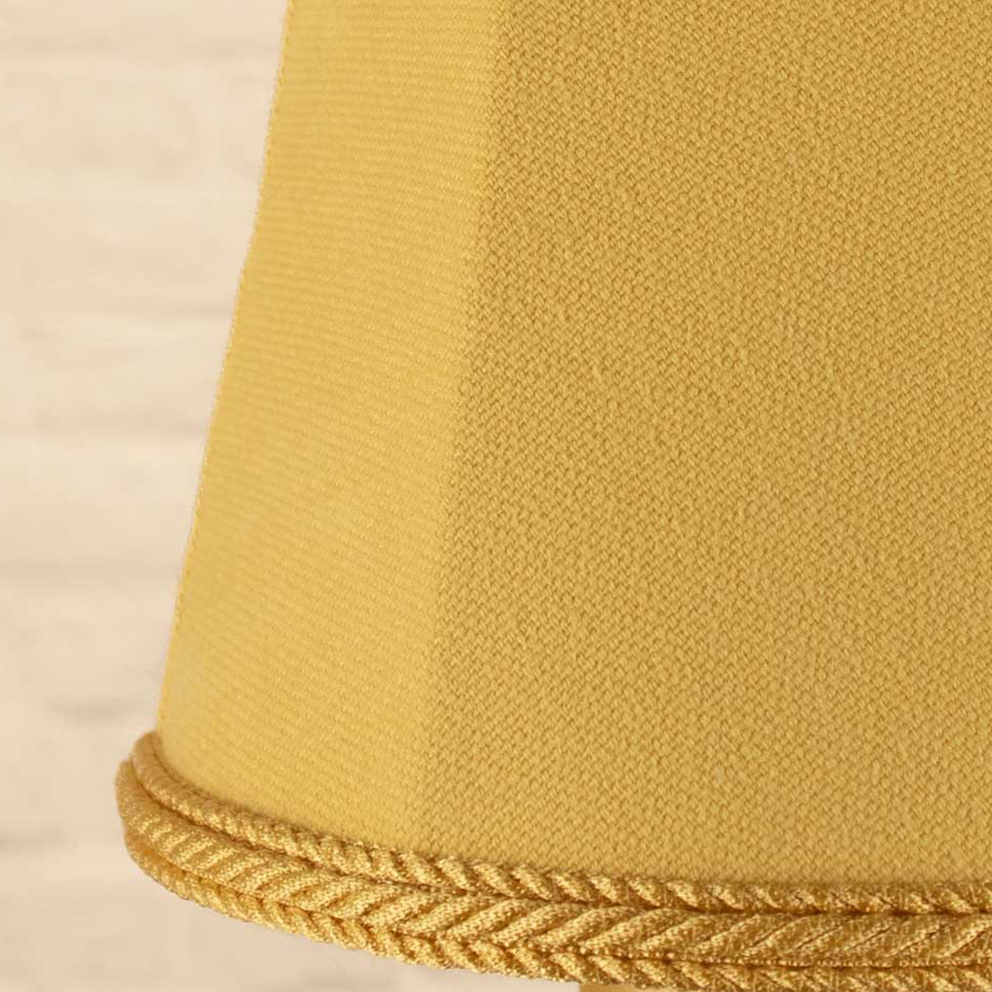 Close-up of soft gold brushed cotton fabric and matching rope trim on empire candle shade