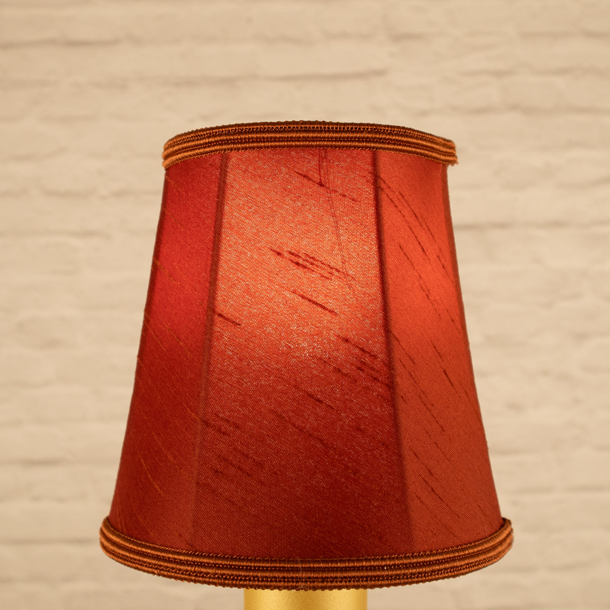 Lit terracotta empire faux silk chandelier shade with matching soutache trim